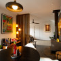 Living and dining area featuring walls and ceiling in Resene Alabaster, brick wall in Grey Friars
