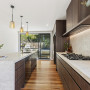 Kitchen featuring neutral walls and ceiling and timber floor