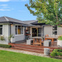 House exterior featuring Resene Pavilion Grey with roof in Ironsand