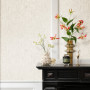 Living area featuring featuring neutral textured wallpaper