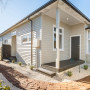 House with exterior featuring Resene Half Grey Olive and trims in Black White