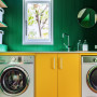 Laundry featuring cabinetry in Resene Bright Spark and walls in Crusoe