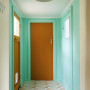 Hallway with walls in Resene Vista Blue, doors in Mai Tai