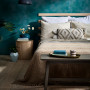 Teal bedroom featuring wall painted in Resene Undercover with Resene FX Paint Effects Medium mixed with Deep Teal and Nepal