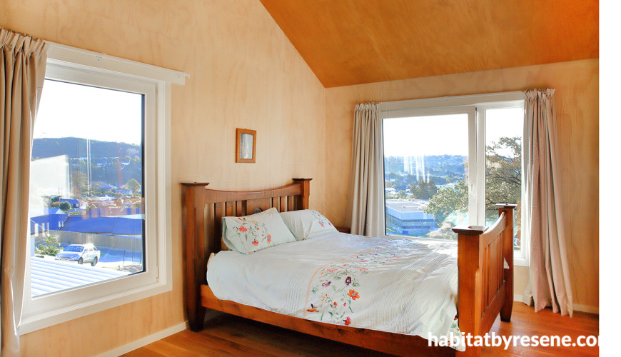 Bedroom featuring timber walls painted in Resene Colorwood Rock Salt