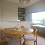 Dining area painted in Resene Half Fossil, ceiling in Alabaster. 