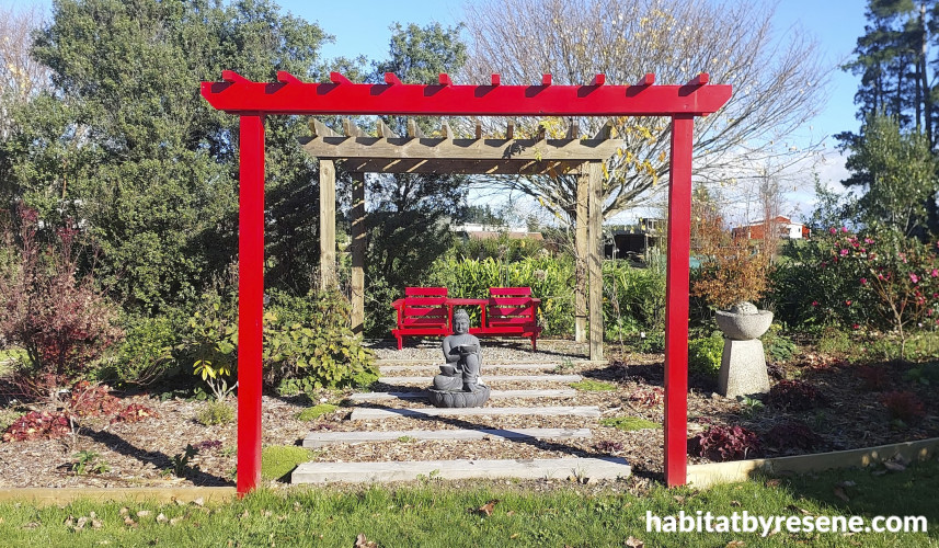 arch and upcycled chairs in Resene Poppy. 