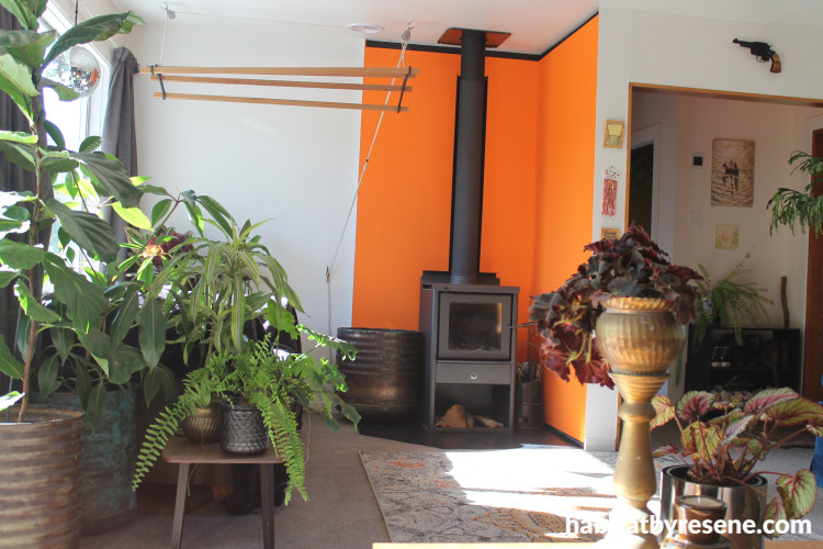 Lounge featuring bright orange Resene Daredevil and neutral Resene Bianca