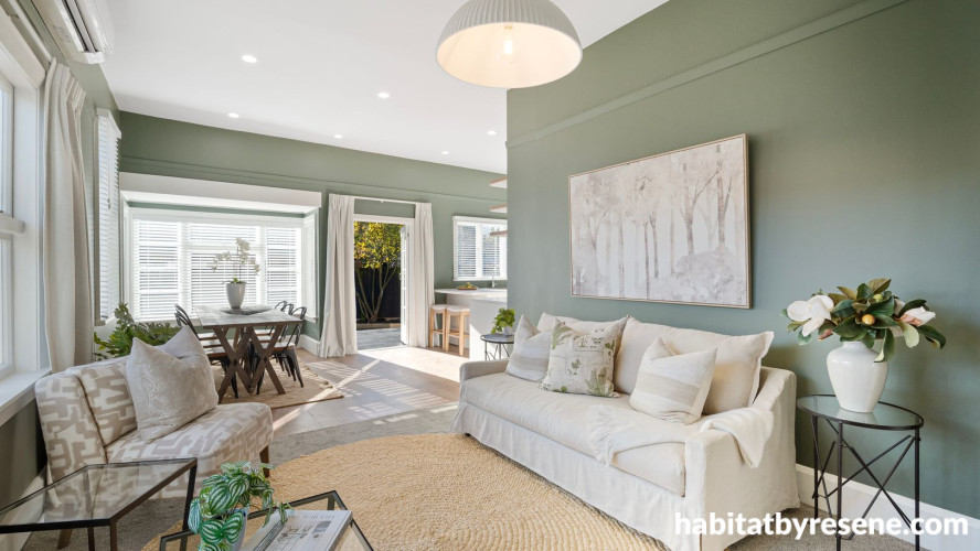 Living room featuring neutral and sage green tones