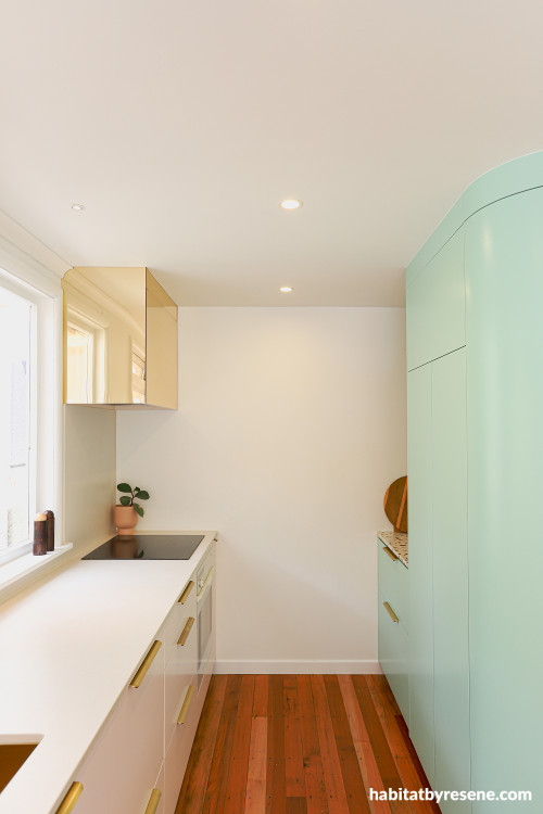 Mint green and white kitchen