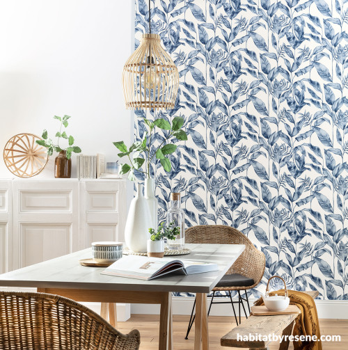Dining room featuring nature-inspired blue wallpaper