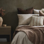 Bedroom featuring Resene Cement and Doeskin mixed with Resene FX Paint Effects Medium