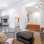 Living and dining area with feature wall in Resene Triple Friar Greystone and walls in Half Alabaster