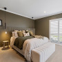 Bedroom featuring walls and panelling in deep, earthy Resene Lisbon Brown