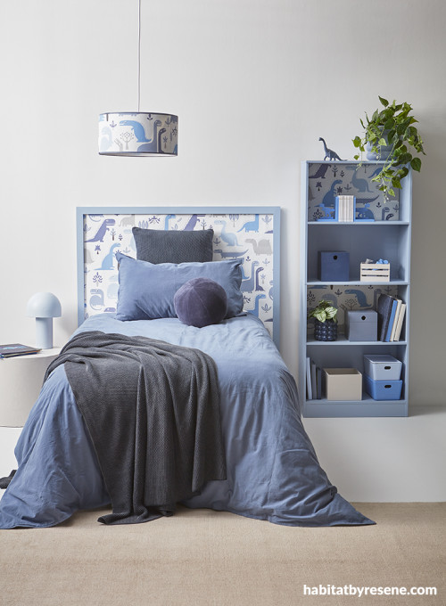 Kid's room featuring blue tones and dinosaurs