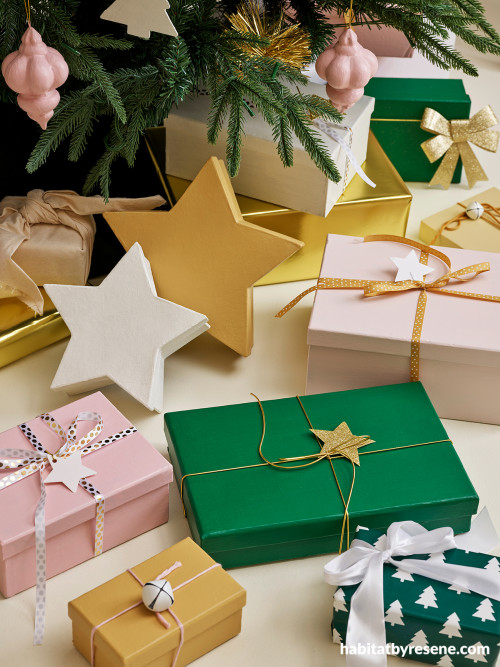 Christmas boxes featuring green, mustard, light pink and white colour palette