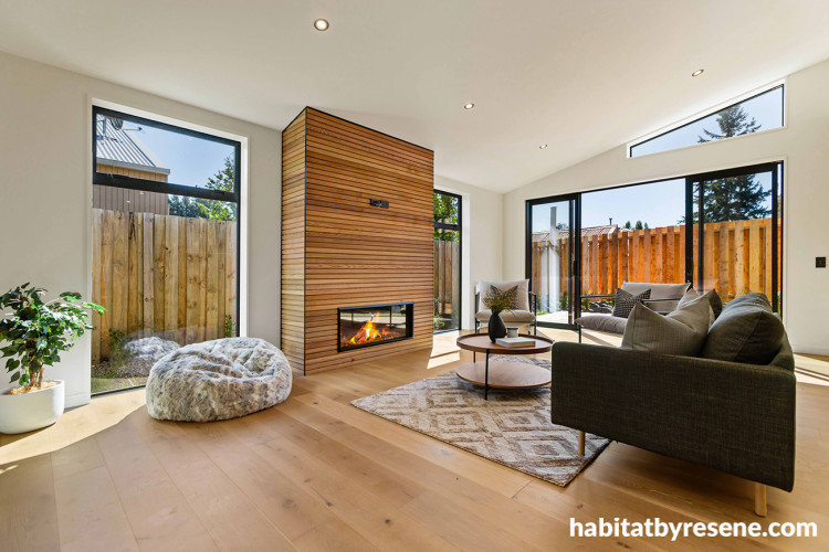 Living room featuring wood panelling and floors, and neutral walls