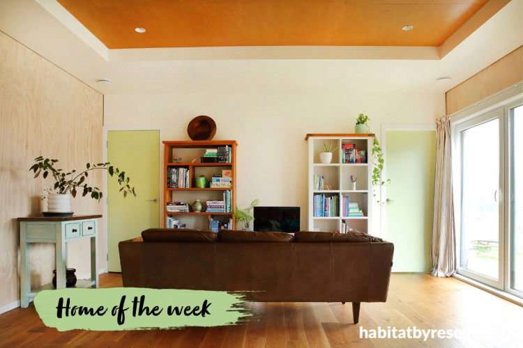 Living room featuring neutral walls and soft green walls